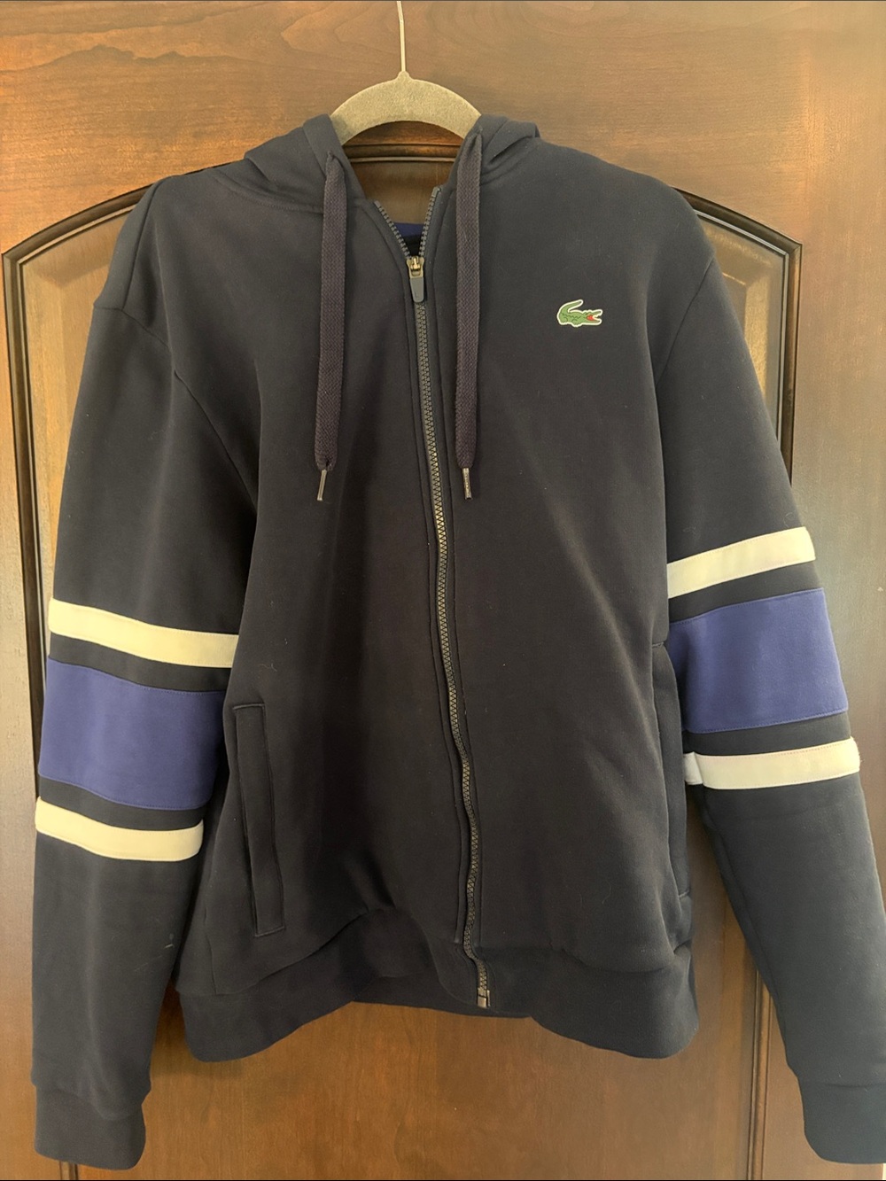 Lacoste Navy Hoodie with White and Blue Sleeve Stripes